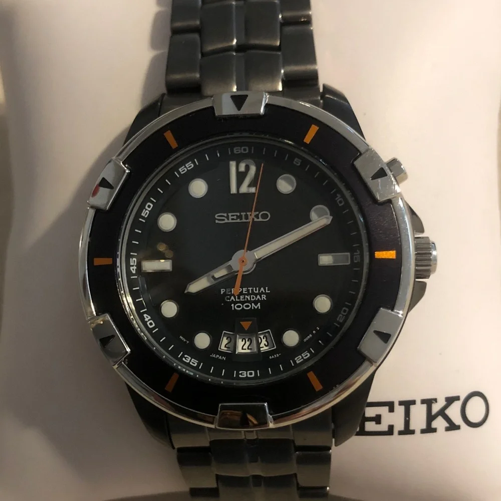 Seiko Black Dial Stainless Steel Watch with Orange Accents